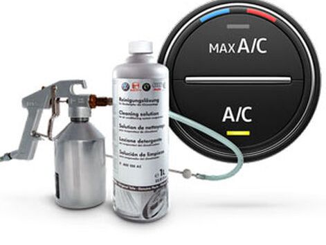 A bottle of car air-con care solution with the application spray; round car button: Max A/C, A/C
